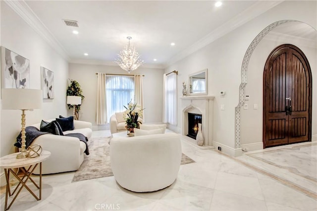 living room featuring a notable chandelier and crown molding