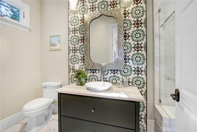 bathroom featuring toilet and vanity