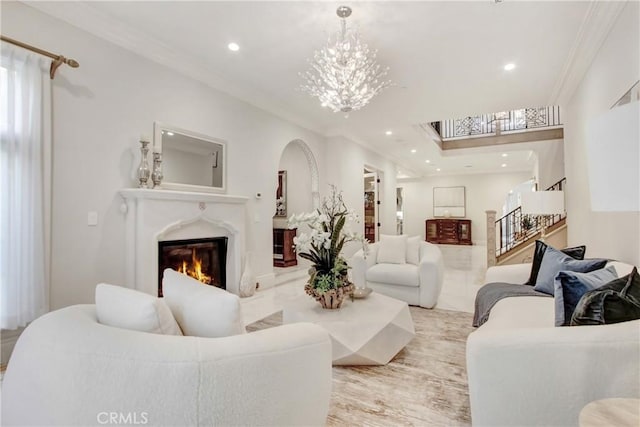 living room featuring ornamental molding and a notable chandelier