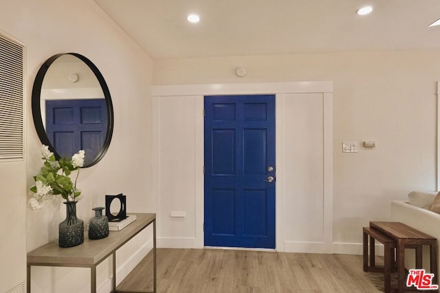 entryway with light hardwood / wood-style floors