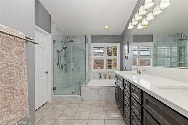 bathroom with vanity and separate shower and tub