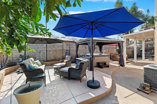 view of patio with an outdoor living space, a gazebo, a hot tub, and central AC unit