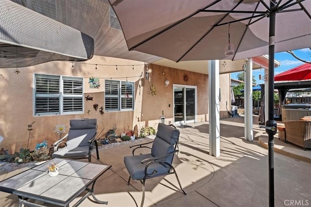 view of patio featuring a hot tub