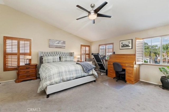 carpeted bedroom with vaulted ceiling and ceiling fan