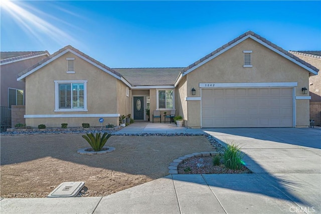 ranch-style house featuring a garage