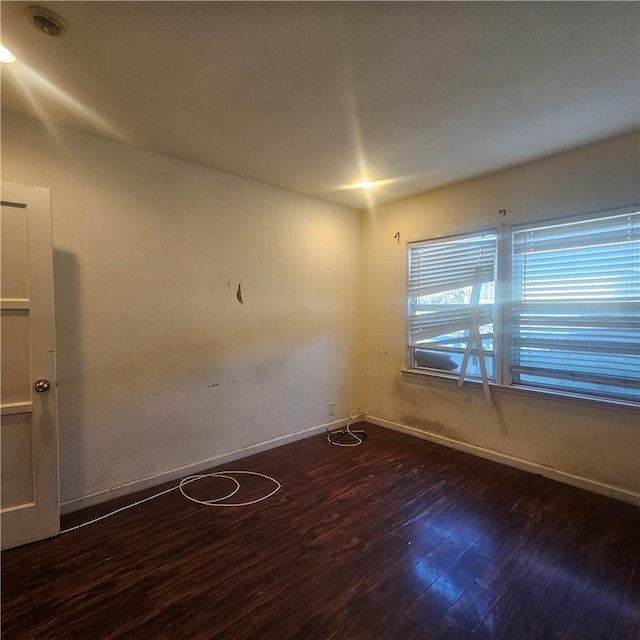 empty room featuring dark hardwood / wood-style floors