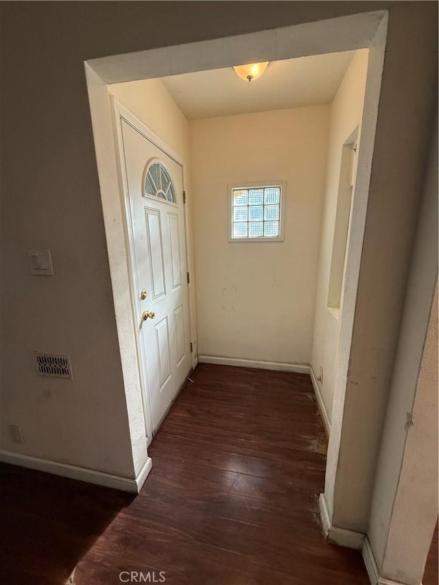 hallway featuring dark hardwood / wood-style flooring