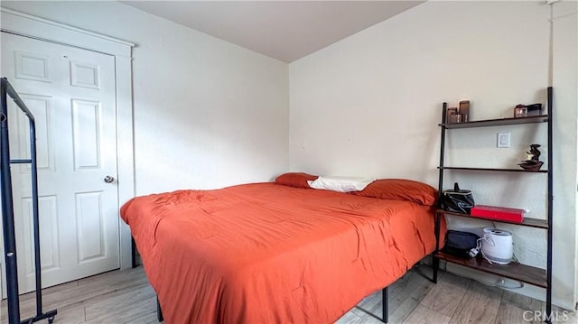 bedroom featuring light wood-type flooring