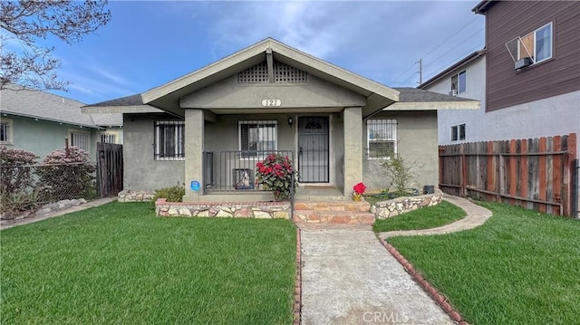 view of front of house featuring a front lawn and a porch