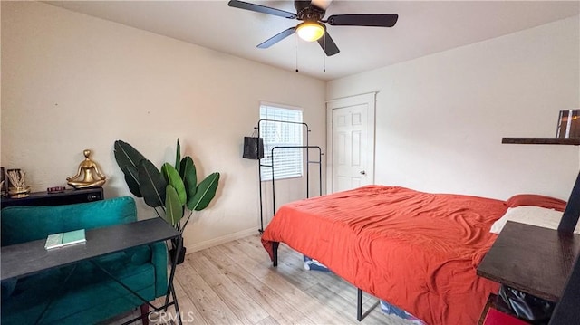 bedroom featuring ceiling fan and light hardwood / wood-style flooring