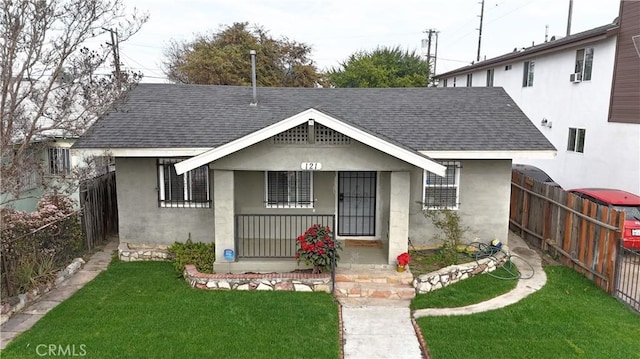 bungalow-style house featuring a porch and a front yard