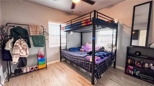 bedroom featuring ceiling fan and hardwood / wood-style flooring