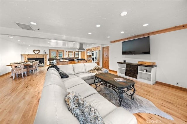 living room with light hardwood / wood-style floors