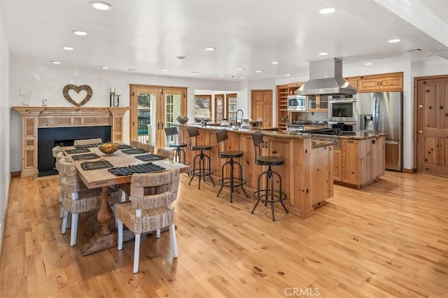 dining room featuring light hardwood / wood-style flooring and french doors