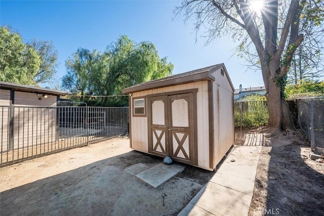 view of shed featuring a fenced backyard