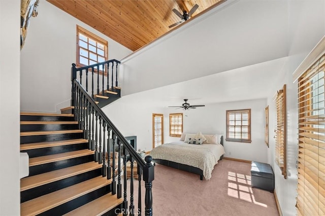 bedroom with wooden ceiling, carpet flooring, and ceiling fan