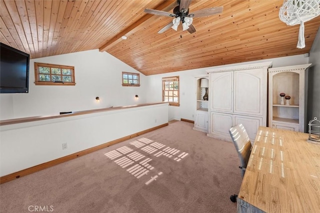 unfurnished office featuring light carpet, ceiling fan, wood ceiling, and lofted ceiling with beams