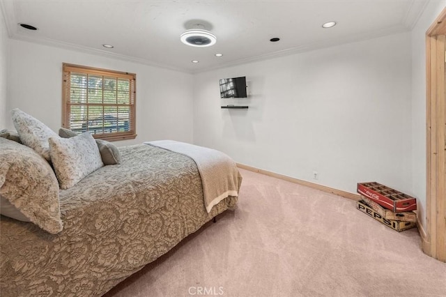 carpeted bedroom featuring crown molding