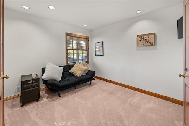 sitting room with light colored carpet