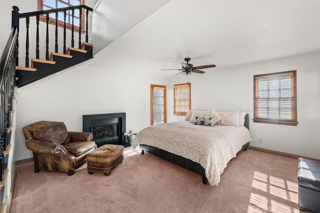 bedroom with ceiling fan and carpet floors