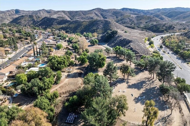 birds eye view of property featuring a mountain view