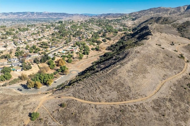 birds eye view of property featuring a mountain view