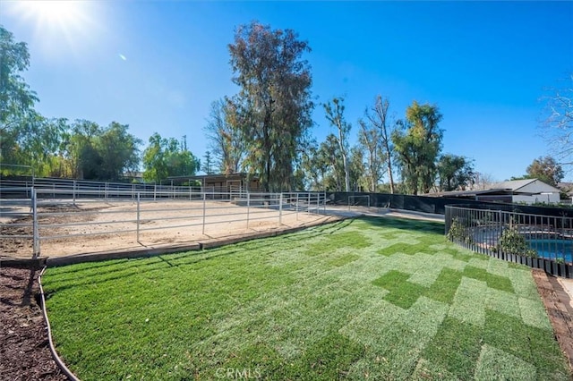 view of yard with a rural view