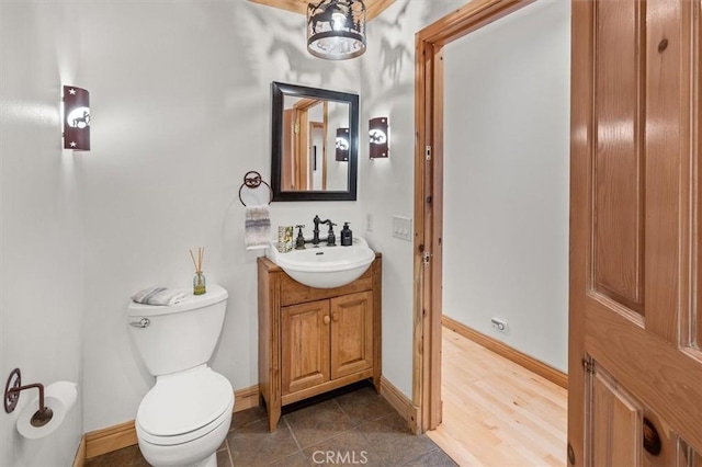 bathroom with toilet and vanity