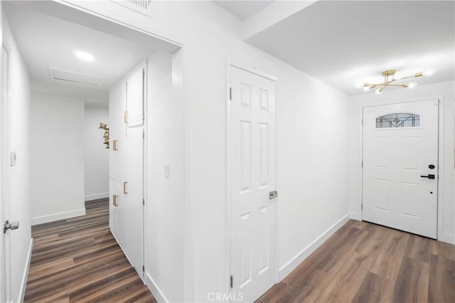 foyer entrance featuring dark wood-type flooring