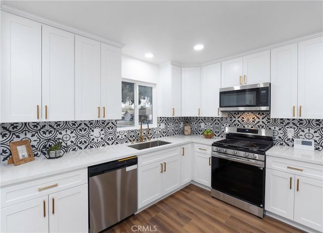 kitchen featuring white cabinets, dark hardwood / wood-style floors, sink, and stainless steel appliances