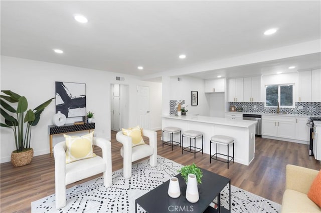 living room with dark hardwood / wood-style flooring