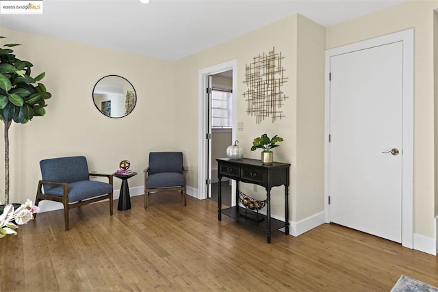 living area with wood-type flooring