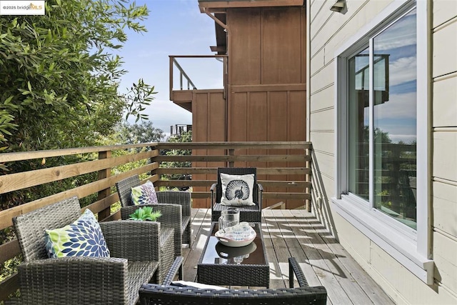 wooden balcony featuring a deck