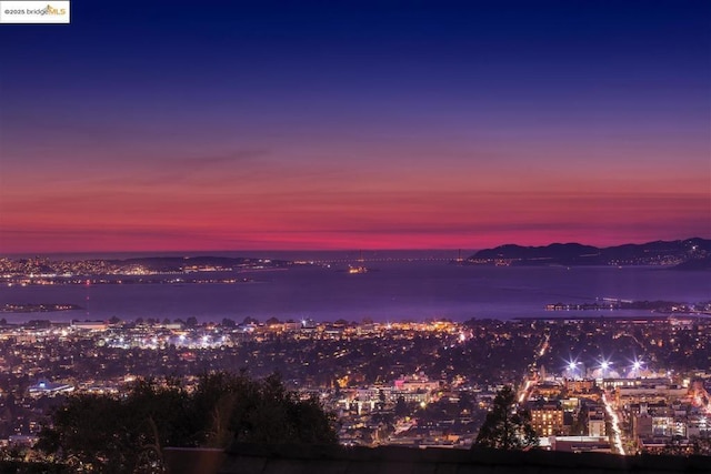 property's view of city with a water view