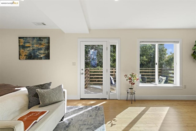 doorway to outside with light wood-type flooring