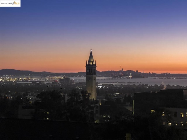 property's view of city featuring a water and mountain view