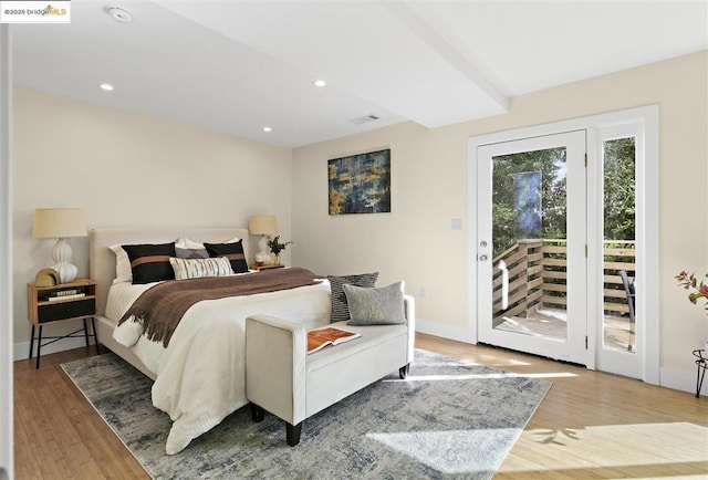 bedroom featuring hardwood / wood-style flooring and access to outside