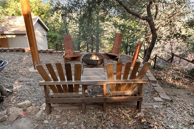 view of patio / terrace featuring a fire pit