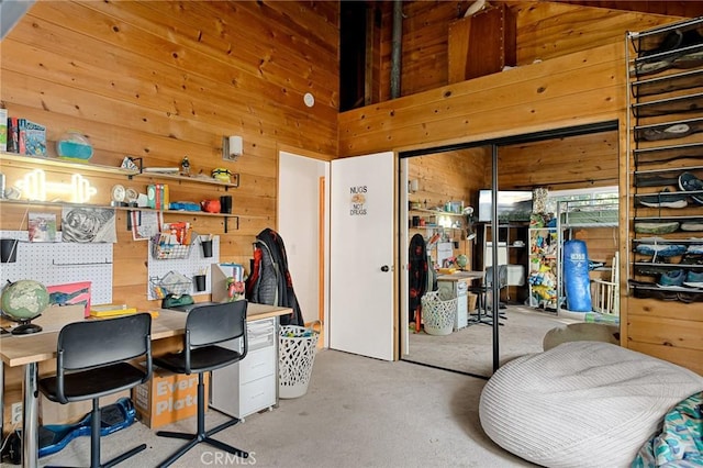 office with a high ceiling and wood walls