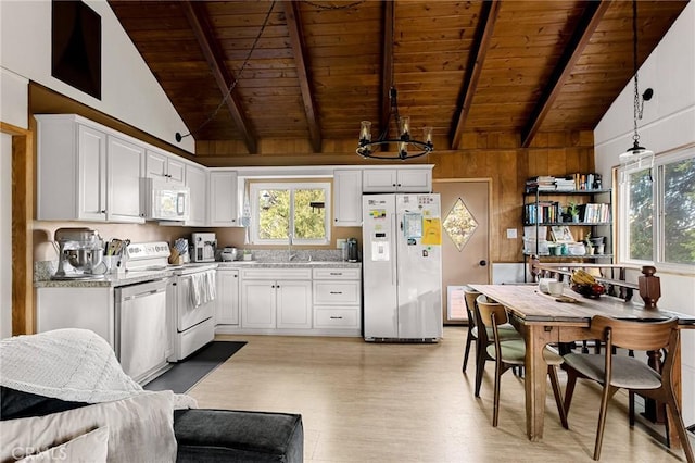 kitchen with wooden ceiling, beam ceiling, hanging light fixtures, and white appliances