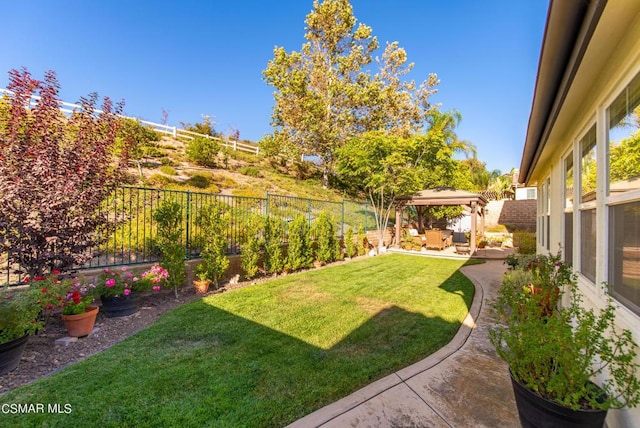 view of yard with a gazebo and a patio