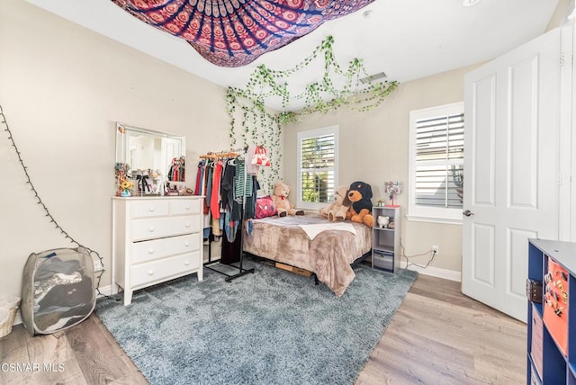 bedroom featuring hardwood / wood-style flooring