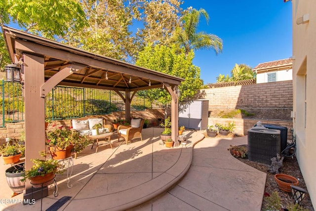 view of patio / terrace featuring a gazebo, outdoor lounge area, and central air condition unit