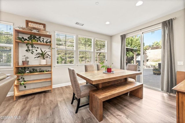 dining space featuring hardwood / wood-style flooring