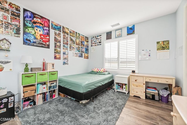 bedroom featuring wood-type flooring