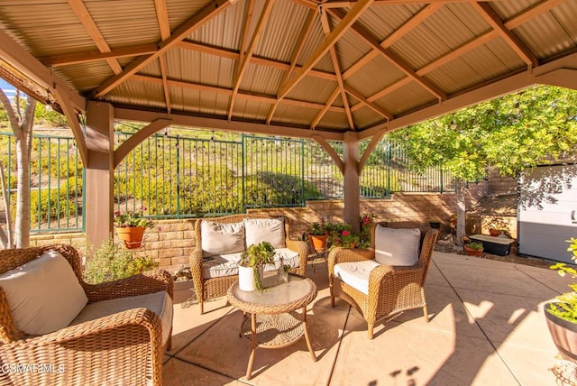 view of patio / terrace with an outdoor living space and a gazebo