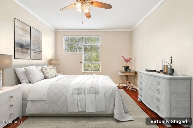 bedroom featuring ceiling fan, hardwood / wood-style flooring, and crown molding