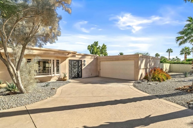 adobe home featuring a garage