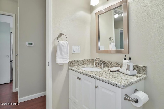 bathroom featuring hardwood / wood-style floors and vanity