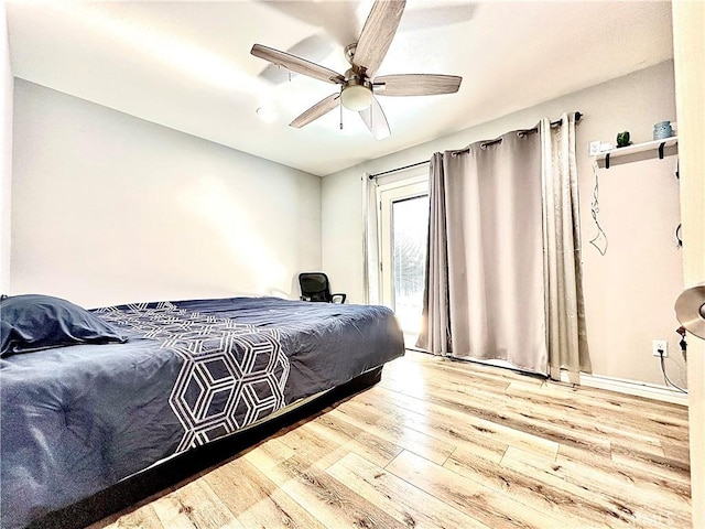 bedroom with ceiling fan and hardwood / wood-style floors